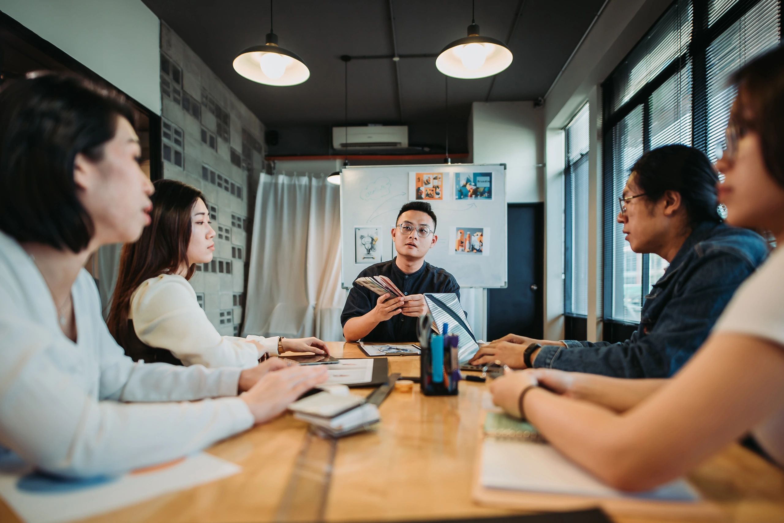 Creative team in a strategy discussion at a studio