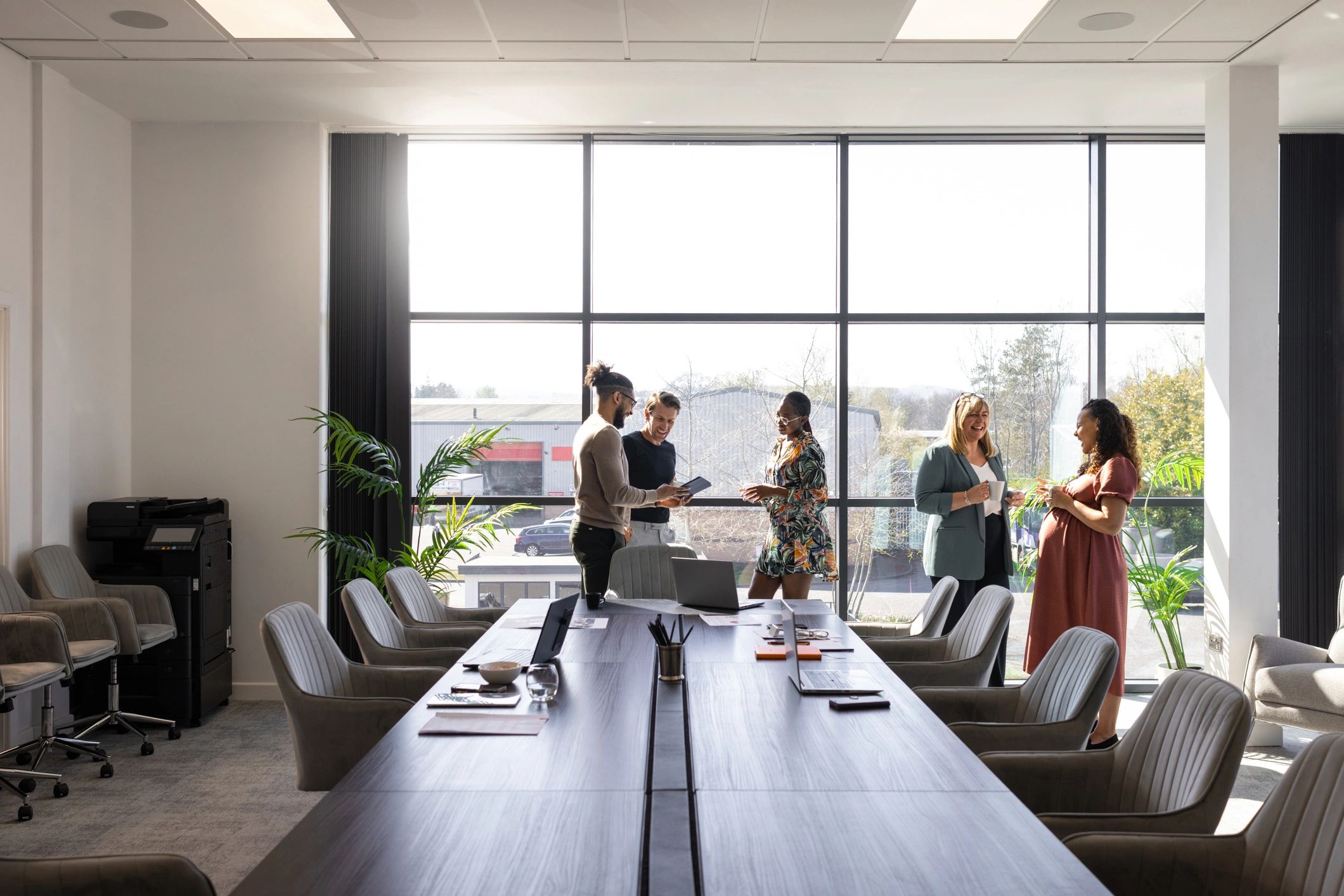 Business colleagues discussing campaign work in a conference room